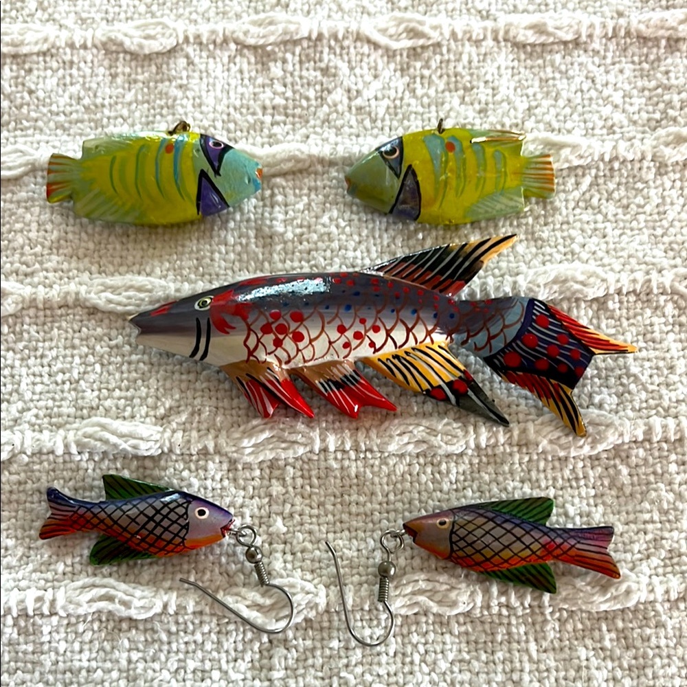My vintage wood fish jewelry. On pin and two pairs of dangling fish earrings.